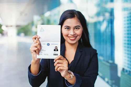 Adjustment of Status - Asian Woman Holding a Work Visa