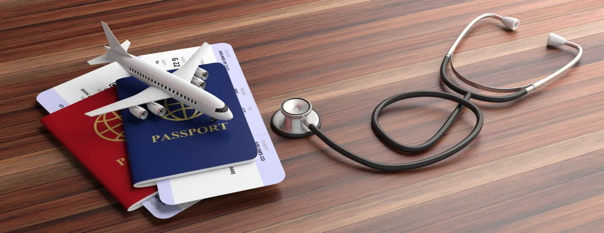 The civil surgeon, blue and red passports and medical stethoscope isolated on wooden background