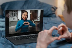 Couple chatting on laptop long-distance relationship